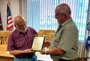 Bill Freeman Jr Receives Service Plaque From Bill Ley